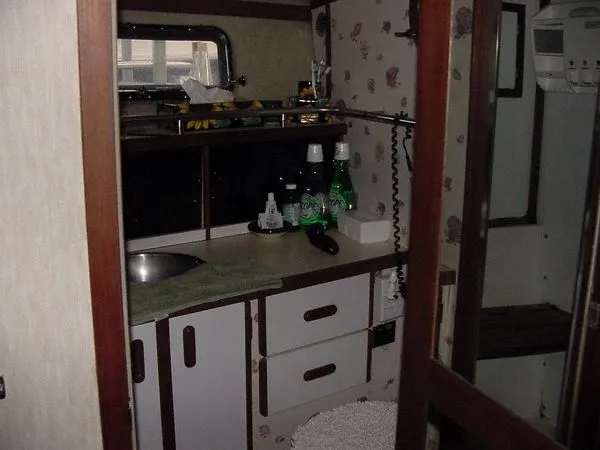 Slide: The Image of Interior of 1985 Carver 3207 Yacht with sink and cabinets. - 12