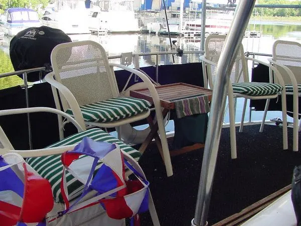 Slide: The Image of Seating area on a 1985 Carver 3207 yacht with striped cushions. - 4