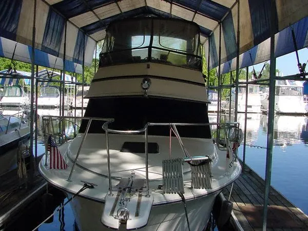 Slide: The Image of 1985 Carver 3207 Aft Cabin Motor Yacht docked in marina. - 5