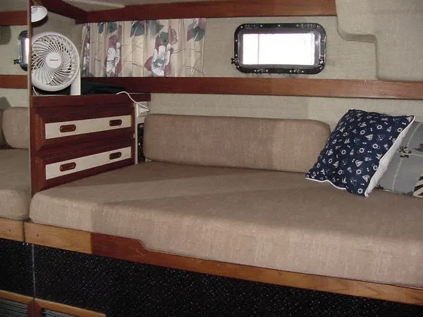 Slide: The Image of Interior of 1985 Carver 3207 Yacht with sofa and pillows. - 9