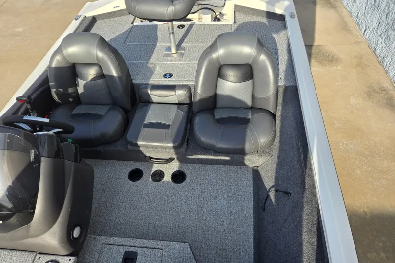 Slide: The Image of 2020 Tracker Pro Team 190 TX Tournament Edition boat interior with gray seating and steering console. - 11