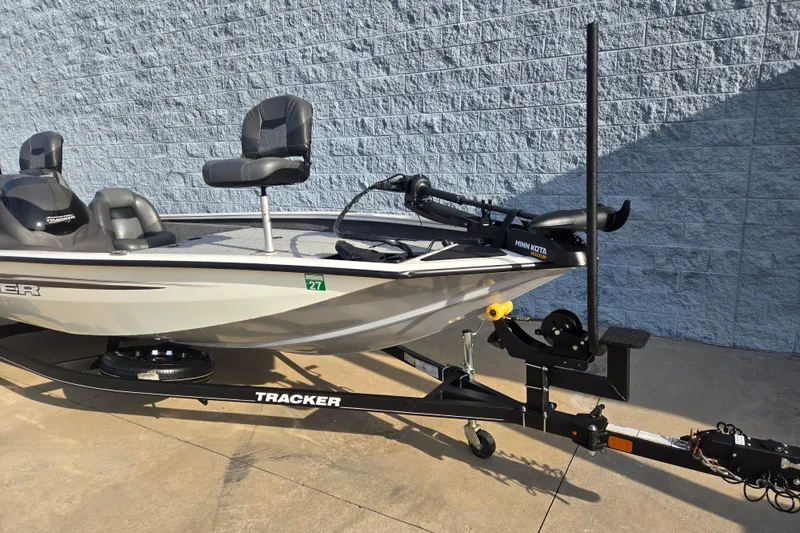 Slide: The Image of 2020 Tracker Pro Team 190 TX Tournament Edition boat on trailer, parked outdoors. - 5
