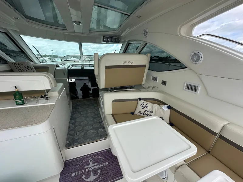 Slide: The Image of Interior of 2010 Sea Ray 470 Sundancer yacht with seating and table. - 10