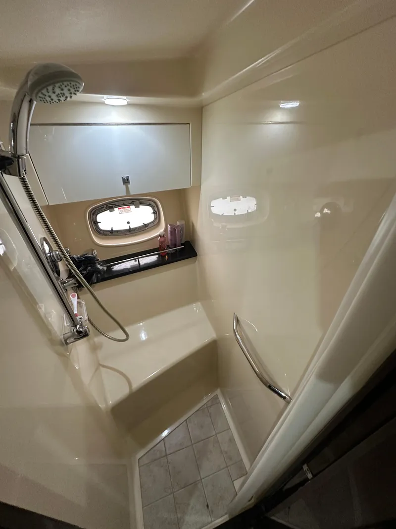 Slide: The Image of Shower area in 2010 Sea Ray 470 Sundancer yacht with modern fixtures and window. - 36