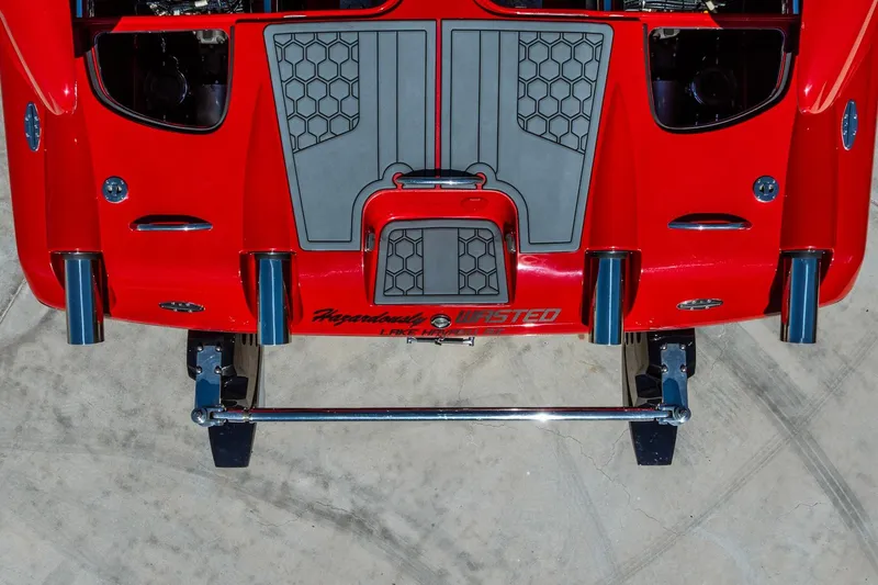 Slide: The Image of Red 2008 Nor-Tech 3600 Supercat boat with sleek design and chrome exhausts. - 12