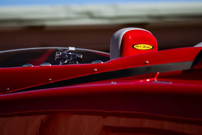 Slide: The Image of 2008 Nor-Tech 3600 Supercat, vibrant red detail with logo, sleek design. - 15