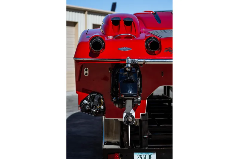 Slide: The Image of Rear view of a 2008 Nor-Tech 3600 Supercat boat, showcasing its sleek red design. - 16