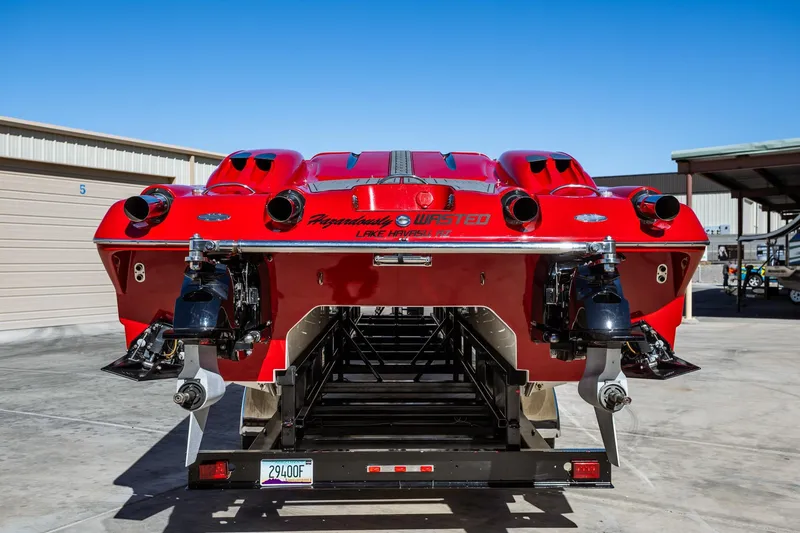 Slide: The Image of 2008 Nor-Tech 3600 Supercat, red, rear view on trailer, parked outdoors. - 20