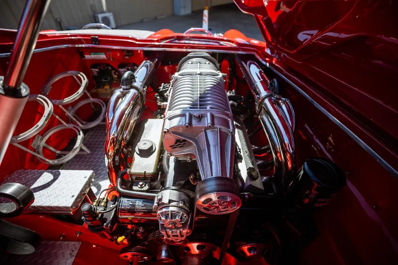 Slide: The Image of 2008 Nor-Tech 3600 Supercat engine compartment with polished components and vibrant red interior. - 26