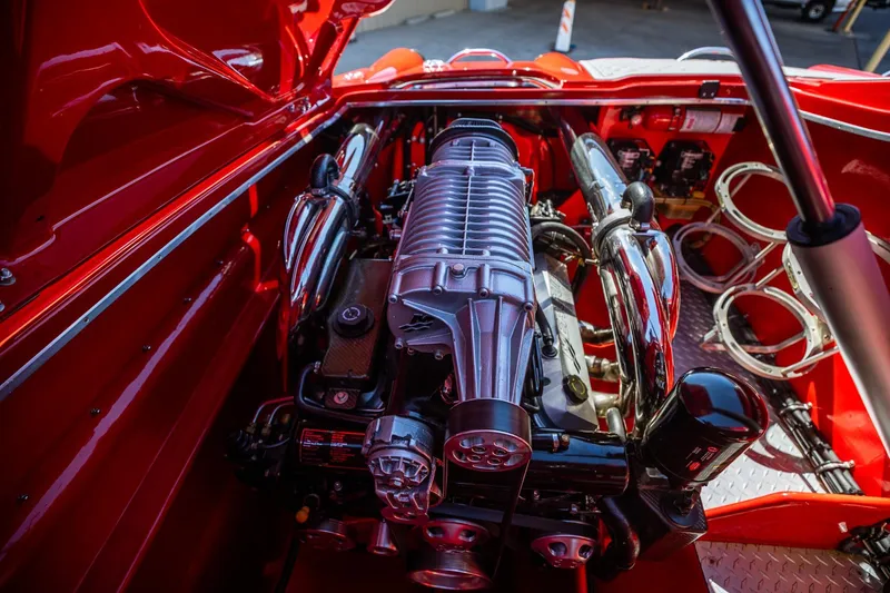 Slide: The Image of 2008 Nor-Tech 3600 Supercat engine compartment with polished components and vibrant red finish. - 27
