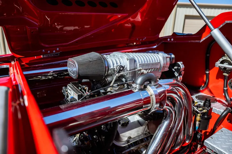 Slide: The Image of Engine of 2008 Nor-Tech 3600 Supercat with chrome components and red accents. - 29