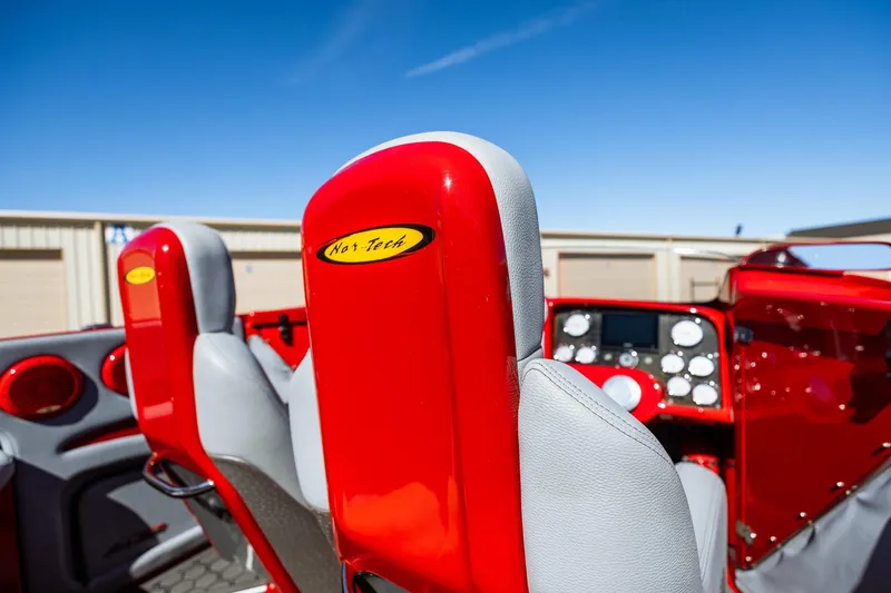 Slide: The Image of 2008 Nor-Tech 3600 Supercat interior with red and gray seats, dashboard, and controls. - 33