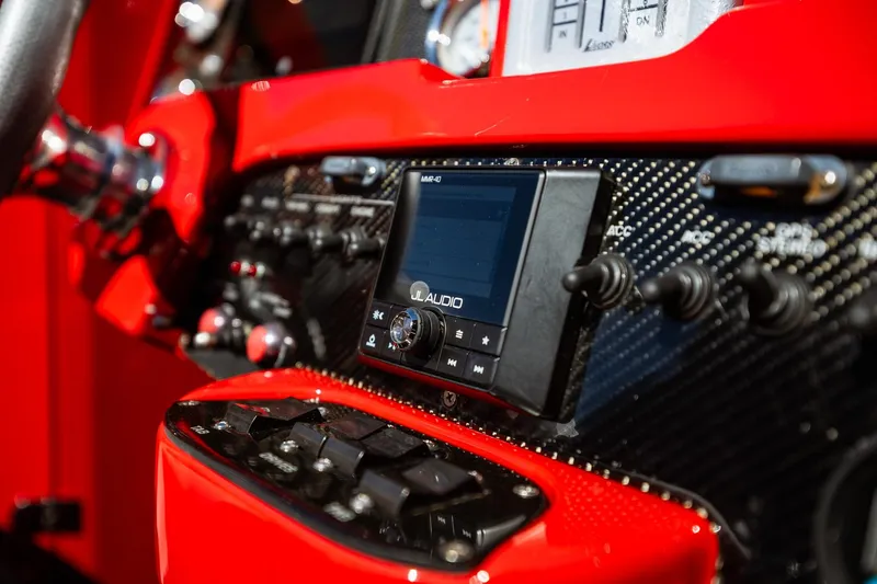 Slide: The Image of Close-up of 2008 Nor-Tech 3600 Supercat dashboard with JL Audio system and controls. - 36