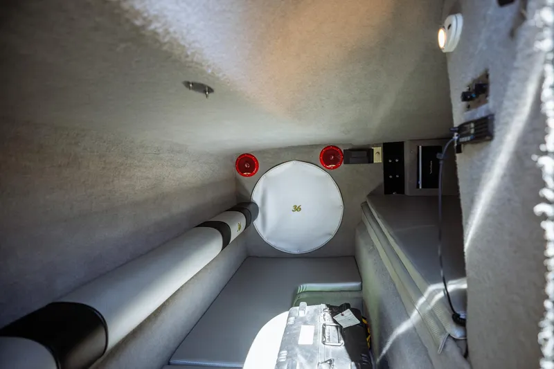 Slide: The Image of Interior cabin of 2008 Nor-Tech 3600 Supercat boat, featuring seating and equipment. - 39