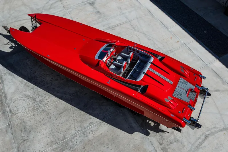 Slide: The Image of 2008 Nor-Tech 3600 Supercat, vibrant red, aerial view on concrete surface. - 4