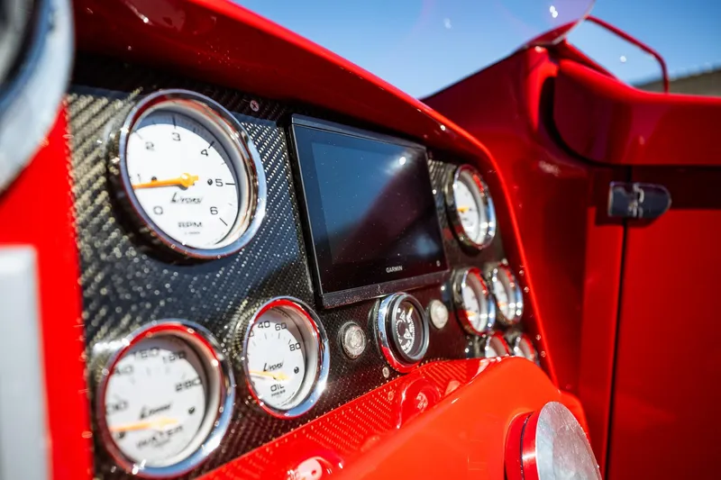 Slide: The Image of Dashboard of a 2008 Nor-Tech 3600 Supercat with gauges and a Garmin display. - 43