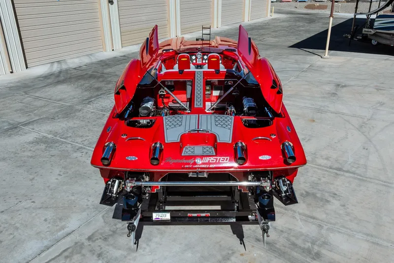 Slide: The Image of 2008 Nor-Tech 3600 Supercat, vibrant red, rear view in a concrete lot. - 9