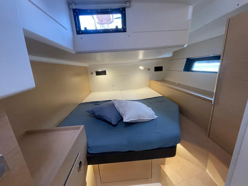 Slide: The Image of Cozy cabin interior of 2023 Hanse 460 yacht with modern design and comfortable bedding. - 10