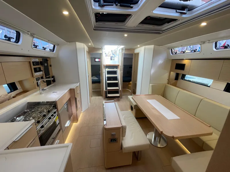 Slide: The Image of Luxurious interior of 2023 Hanse 460 yacht with modern kitchen and dining area. - 8