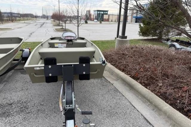 Slide: The Image of 2024 Tracker Grizzly 1436 Jon boat on trailer in parking lot. - 4