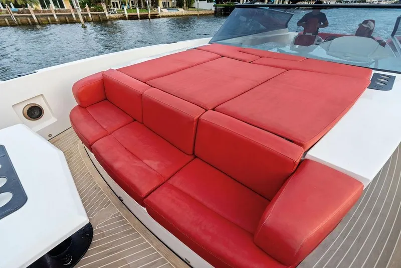 Slide: The Image of Luxurious red seating on 2016 Vanquish Yachts VQ48, docked by the water. - 19