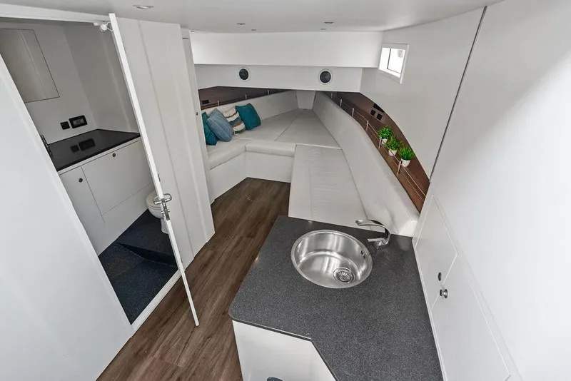 Slide: The Image of Luxurious interior of 2016 Vanquish Yachts VQ48 with modern kitchen and cozy seating area. - 21