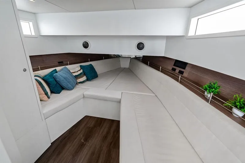 Slide: The Image of Luxurious interior of 2016 Vanquish Yachts VQ48 with plush seating and decorative pillows. - 24