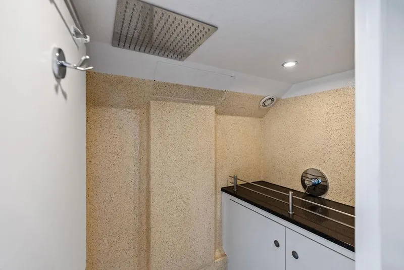 Slide: The Image of Luxurious bathroom interior of 2016 Vanquish Yachts VQ48 with modern fixtures and sleek design. - 26