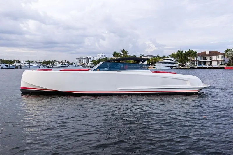 Slide: The Image of 2016 Vanquish Yachts VQ48 luxury yacht on calm waters, showcasing sleek design. - 8