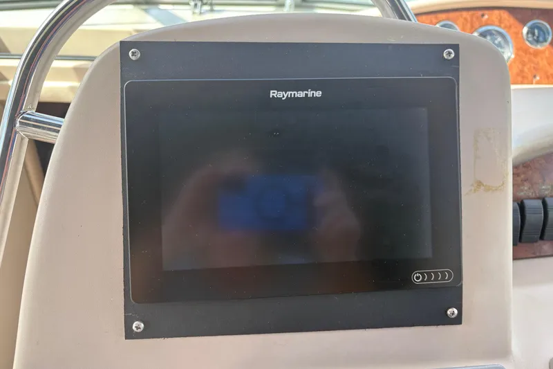 Slide: The Image of Control panel of a 2000 Sea Ray 340 Sundancer boat with Raymarine equipment. - 10