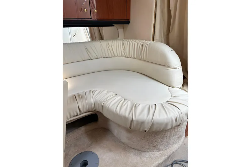 Slide: The Image of Luxurious cream leather seating in 2000 Sea Ray 340 Sundancer cabin interior. - 13