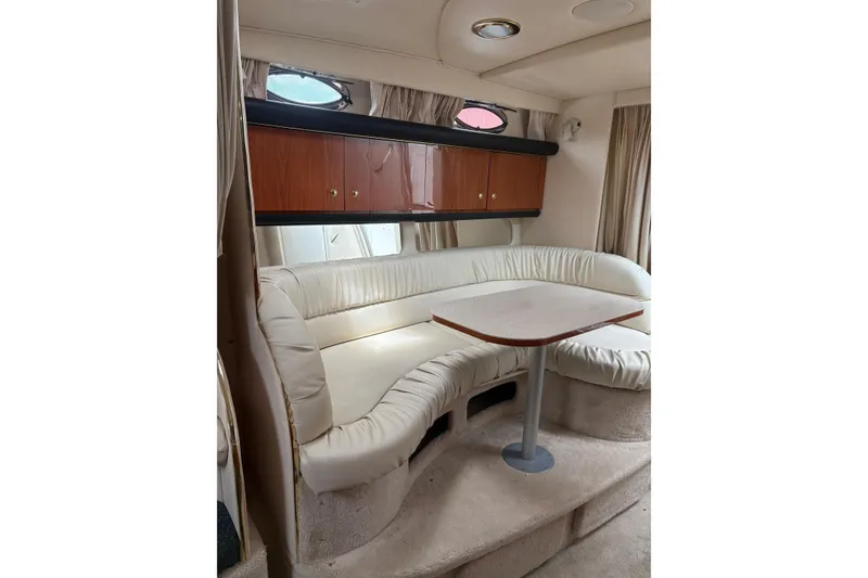 Slide: The Image of Interior cabin of 2000 Sea Ray 340 Sundancer with bed, mirror, and storage. - 14