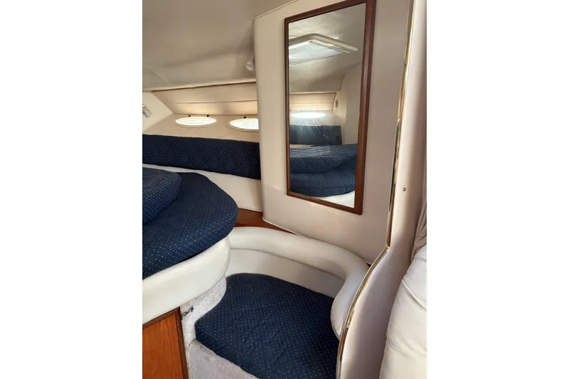 Slide: The Image of Interior cabin of 2000 Sea Ray 340 Sundancer with mirror and blue upholstery. - 16