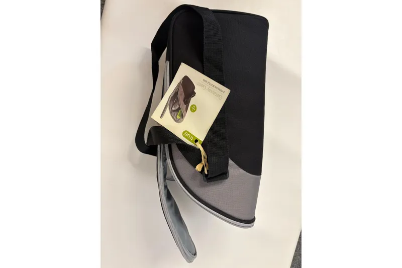 Slide: The Image of Black and gray travel bag with a tag, featuring a shoulder strap. - 22