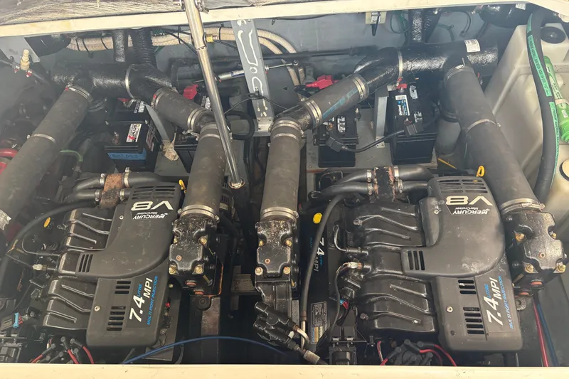 Slide: The Image of Engine compartment of a 2000 Sea Ray 340 Sundancer with twin Mercury V8 engines. - 23