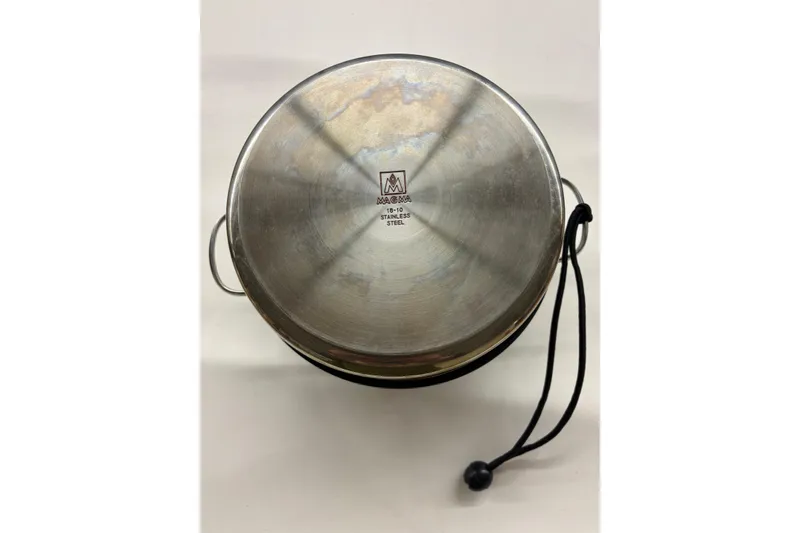 Slide: The Image of Stainless steel cookware with handles and a cord, featuring Magma branding. - 26
