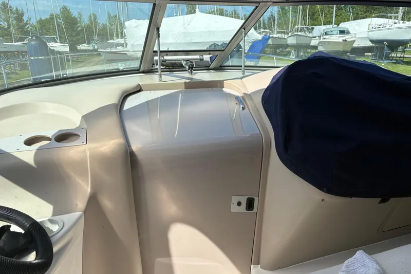 Slide: The Image of White leather seating on a 2000 Sea Ray 340 Sundancer boat interior. - 3