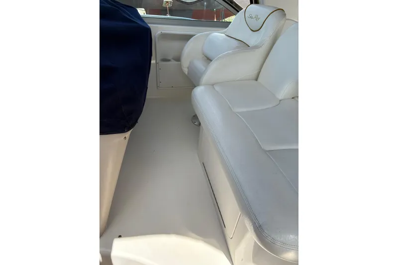 Slide: The Image of Cockpit of 2000 Sea Ray 340 Sundancer with steering wheel and navigation equipment. - 5