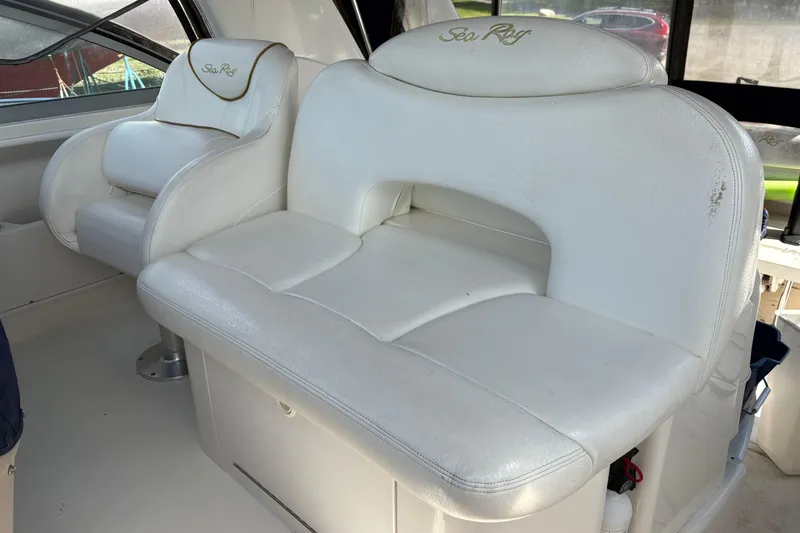 Slide: The Image of Cockpit of 2000 Sea Ray 340 Sundancer with steering wheel and navigation equipment. - 6