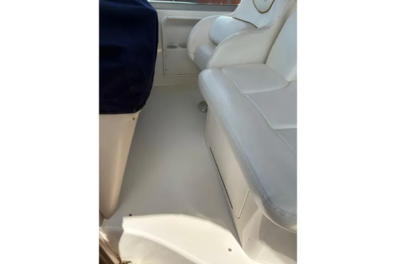 Slide: The Image of Cockpit of 2000 Sea Ray 340 Sundancer with steering wheel and navigation equipment. - 7
