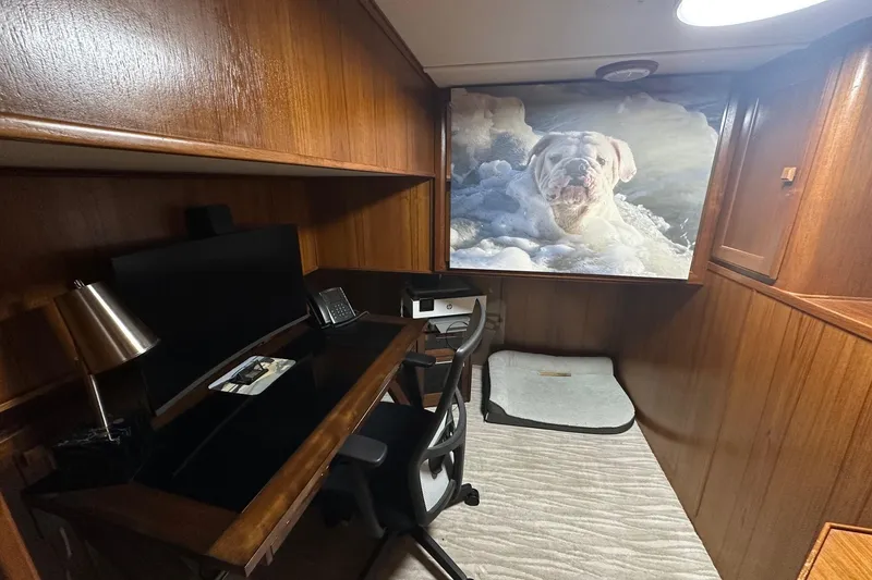 Slide: The Image of Cozy office space on 1997 Lazy Days 16x85 houseboat with dog artwork. - 11