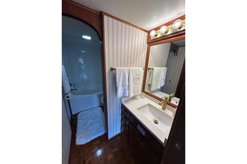 Slide: The Image of Luxurious bathroom in 1997 Lazy Days 16x85 houseboat with elegant fixtures and cozy decor. - 12