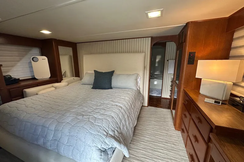 Slide: The Image of Cozy bedroom interior in a 1997 Lazy Days 16x85 houseboat with modern decor. - 14