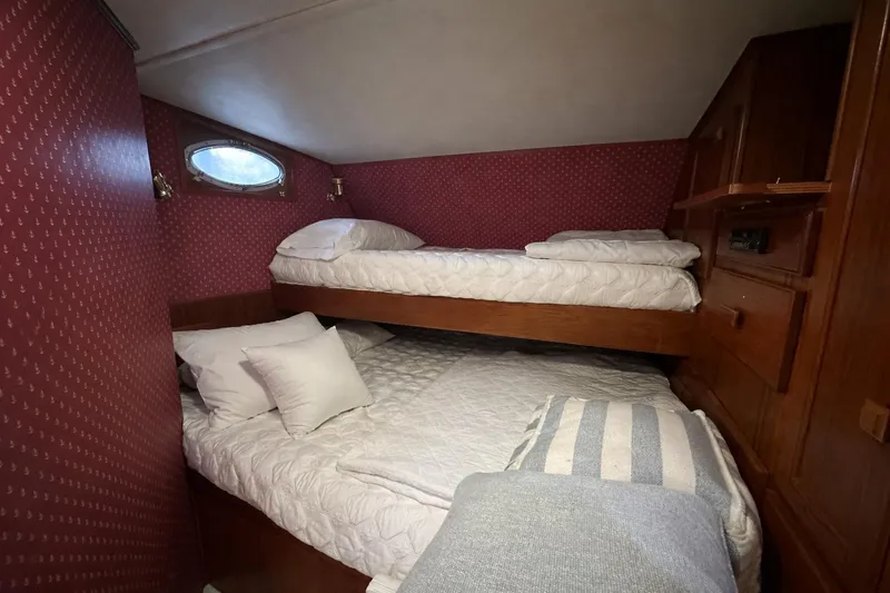 Slide: The Image of Cozy cabin bedroom with bunk beds in 1997 Lazy Days 16x85 houseboat. - 9