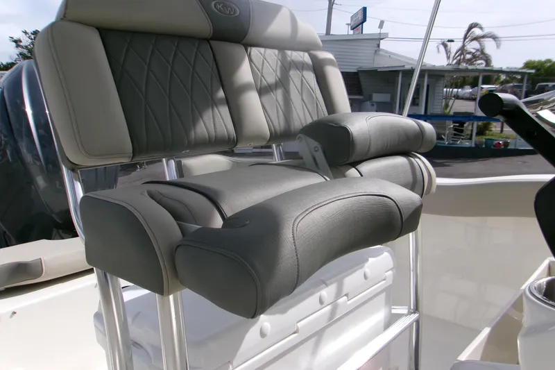 Slide: The Image of 2026 Key West 203 FS boat seat with cushioned armrests and backrest. - 11