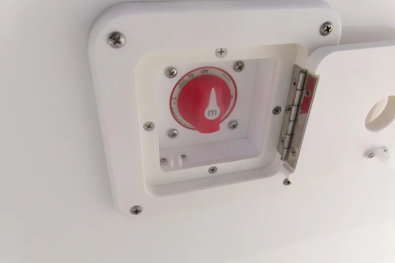 Slide: The Image of Red switch on 2026 Key West 203 FS boat panel, secured with screws. - 13