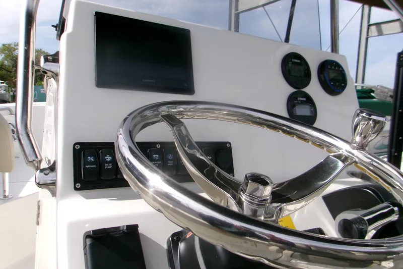 Slide: The Image of Steering console of 2026 Key West 203 FS boat with modern controls and gauges. - 6