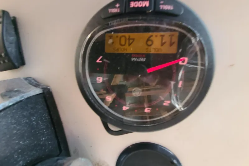 Slide: The Image of Close-up of a cracked RPM gauge on a 1983 Mako 20 Center Console boat. - 13