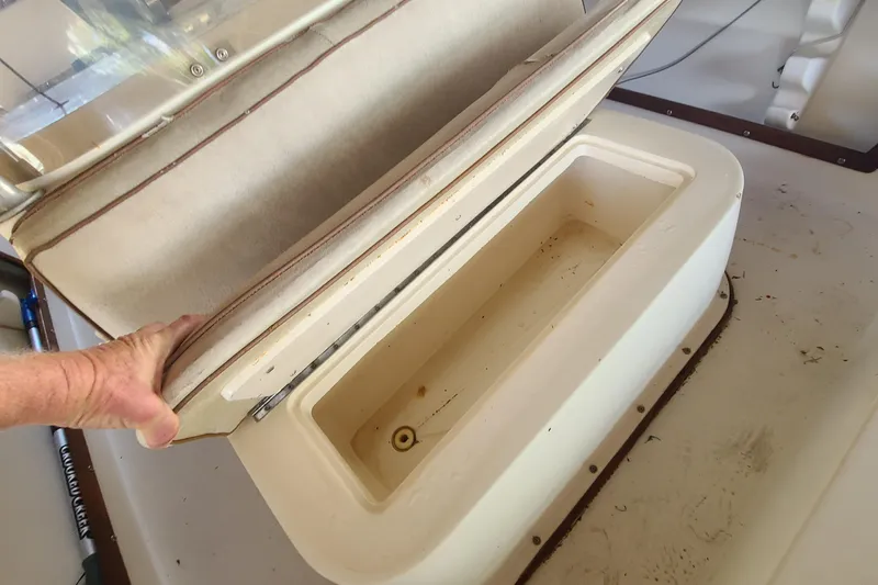 Slide: The Image of Open storage compartment on 1983 Mako 20 Center Console boat. - 5