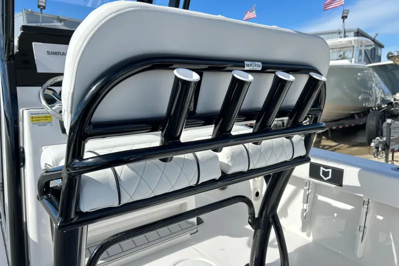 Slide: The Image of 2026 Sea Fox 228 Commander boat interior with rod holders and seating. - 11